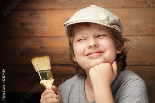 Foto: happy boy with paint brush happy boy with paint brush