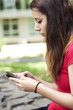 Young woman texting a message