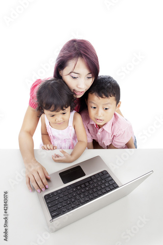 Photo: Family using laptop Family using laptop