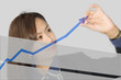 business woman drawing a graph