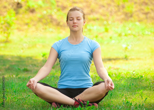 Photo: Woman doing yoga exercise Woman doing yoga exercise