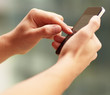 Young man touching a modern mobile, closeup