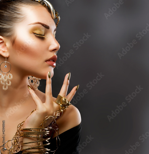 Photo: Fashion Girl Portrait. Golden Makeup Fashion Girl Portrait. Golden Makeup