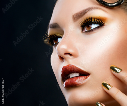 Photo: Golden Luxury Makeup. Fashion Girl Portrait Golden Luxury Makeup. Fashion Girl Portrait