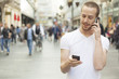 Photo: Speaking on one mobile phone and holding secund cell in hand Speaking on one mobile phone and holding secund cell in hand
