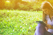 Beautiful Woman With Tablet Computer In Park