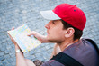 Tourists on the street looking at a guide