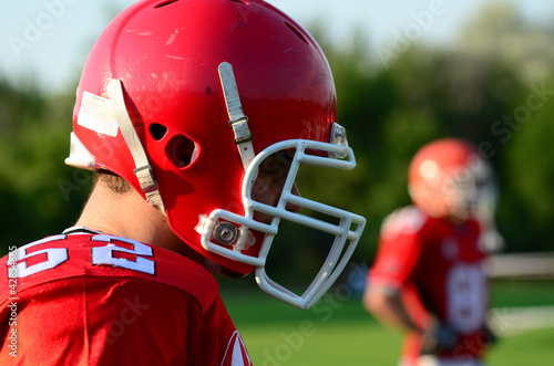 Photo: american football player wearing red helmet american football player wearing red helmet