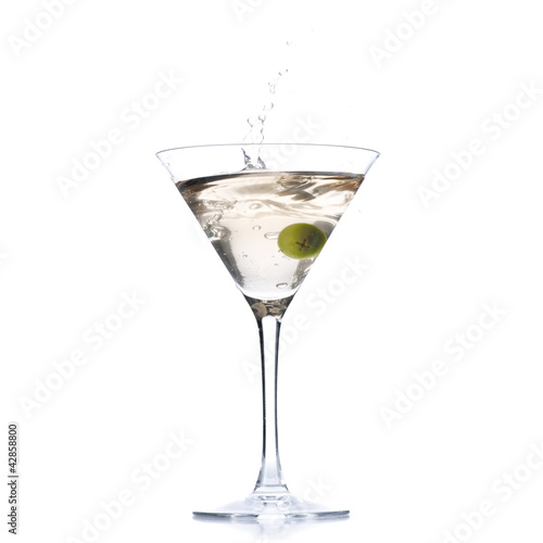 Photo: Cocktail with olive splash isolated on white Cocktail with olive splash isolated on white