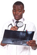 doctor standing and analysing a radiography