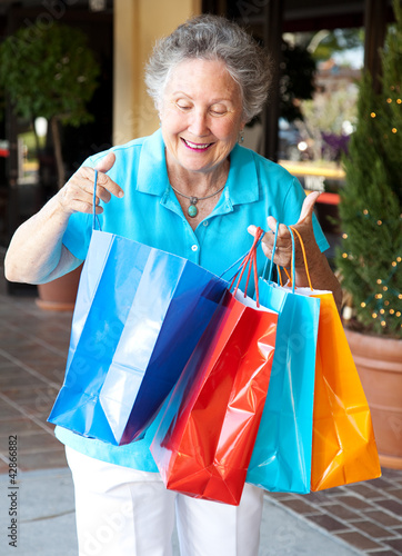 Photo: Senior Shopper Inspects Bags Senior Shopper Inspects Bags