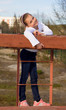 A girl in jeans and sneakers to the playground