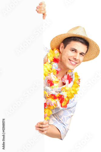 Foto: A portrait of a smiling man wearing traditional costume and hold A portrait of a smiling man wearing traditional costume and hold