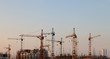 Construction cranes in the sky