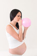 Photo: pregnant woman with pink balloon pregnant woman with pink balloon