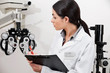 Eye Doctor Writing About Phoropter