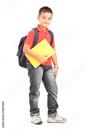 Photo: Full length portrait of a happy school boy with backpack holding Full length portrait of a happy school boy with backpack holding