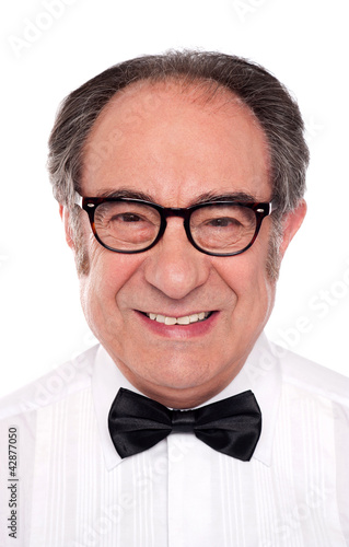 Photo: Closeup portrait of smiling senior man Closeup portrait of smiling senior man