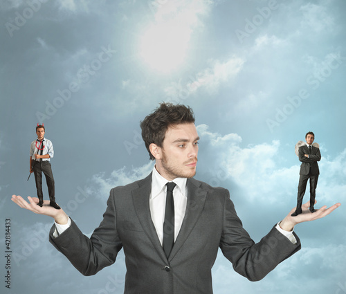 Foto: Businessman with devil and angel Businessman with devil and angel