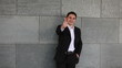 Business man holding thumbs up