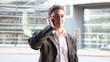 Urban businessman talking with smartphone