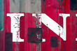 Photo: White paint splatters on a red steel wall background texture White paint splatters on a red steel wall background texture