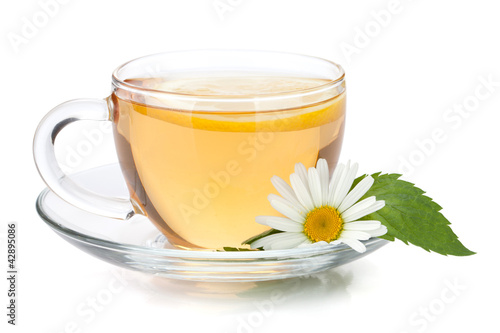 Photo: Cup of tea with lemon slice, mint leaves and chamomile flower Cup of tea with lemon slice, mint leaves and chamomile flower