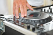 Working Disc jockey at party. Detail of a dj hands.