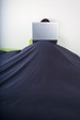 laptop on top bedcover mountain