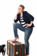 Photo: Pretty young woman preparing to leave home Pretty young woman preparing to leave home