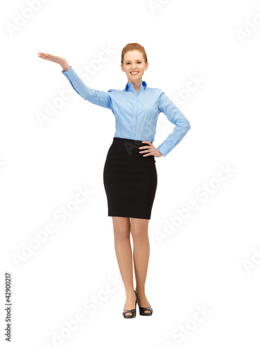 Photo: smiling stewardess showing direction smiling stewardess showing direction