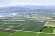 Photo: Aerial view of Oxnard farm fields in spring with Ventura City and Pacific Ocean in background, Ventura County, CA Aerial view of Oxnard farm fields in spring with Ventura City and Pacific Ocean in background, Ventura County, CA