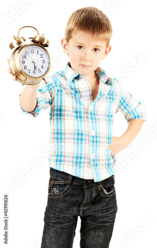 Foto: funny little boy with alarm clock isolated on white funny little boy with alarm clock isolated on white