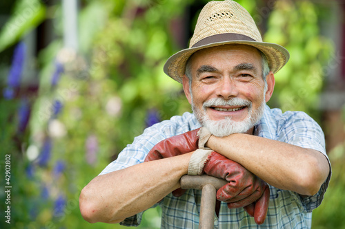 Photo: Senior gardener with a spade Senior gardener with a spade