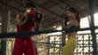 Young woman at boxing and self defense lesson in gym