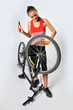 Photo: a woman and a broken bicycle a woman and a broken bicycle