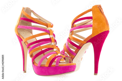 Photo: Pare of pink and orange shoes isolated on white background . Pare of pink and orange shoes isolated on white background .