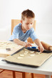 Small boy baking cookies