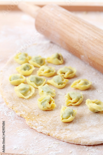 Foto: Dough with raw tortellini Dough with raw tortellini