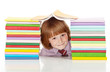 School boy with lots of colorful books