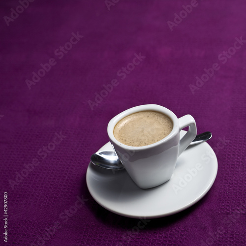 Photo: Coffee cup on a purple background Coffee cup on a purple background