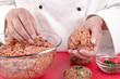 Foto: female chef making meat balls female chef making meat balls