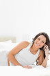 Brunette smiling while calling