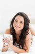Close-up of an attractive brunette with a cup of coffee