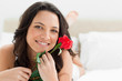 Pretty woman holding a rose 