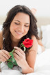 Beautiful woman holding a rose