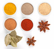  Different spices in white bowls isolated on white background.