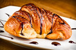 Photo: Fresh and tasty croissant on the white Fresh and tasty croissant on the white