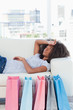 Close-up of an exhausted woman lying on her sofa 