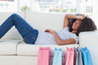 Exhausted woman lying on her sofa 
